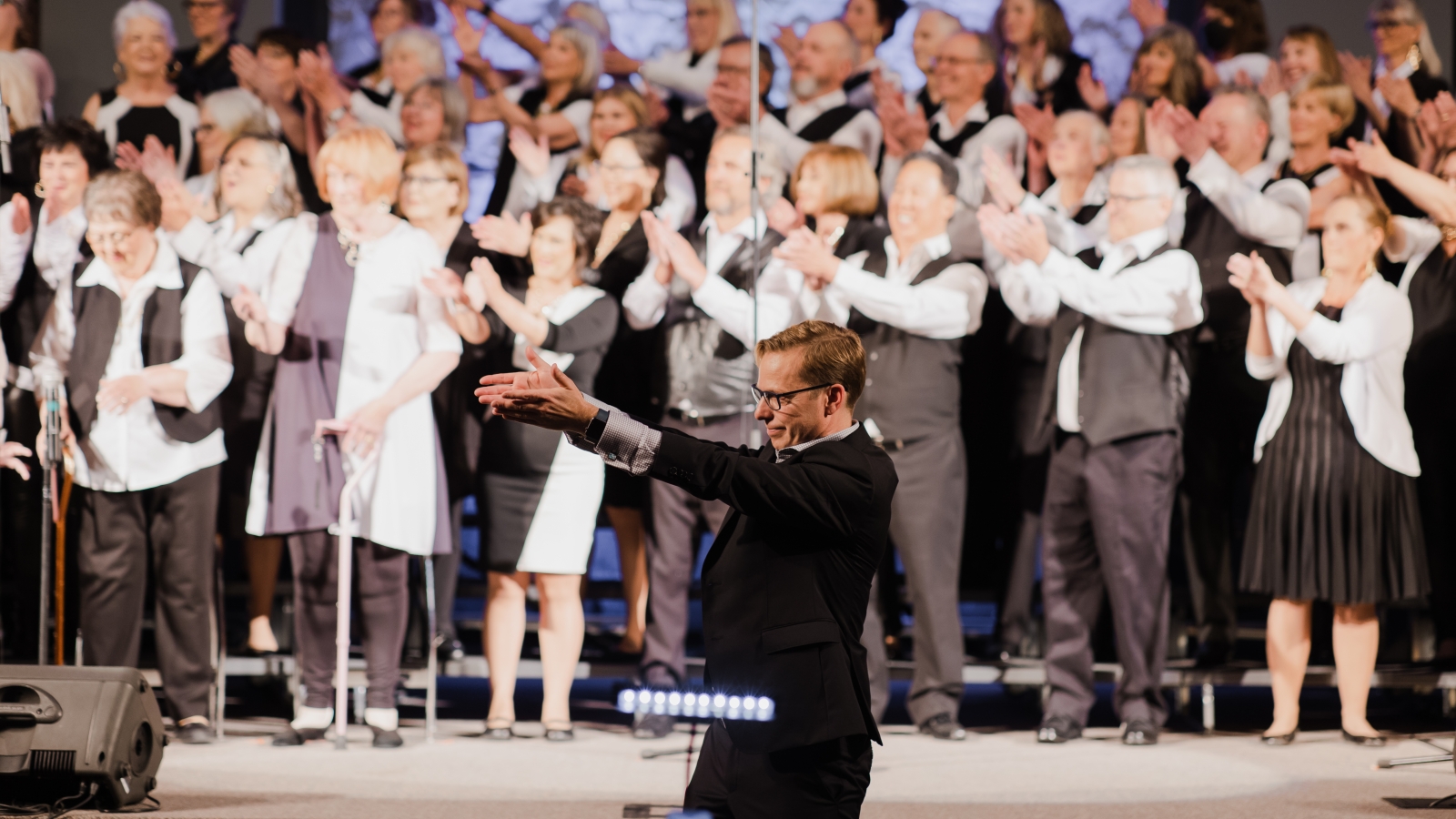 Members of the ARC choir performing in 2022 with Artistic Director Torri Airhart.. 